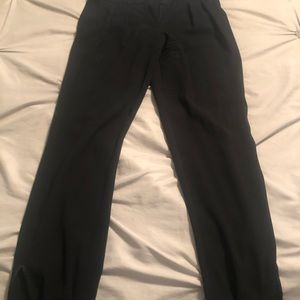 Women’s dress pants with a button at the bottom